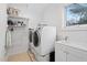 Convenient laundry room with washer, dryer, and utility sink at 617 Tower St, Raleigh, NC 27607