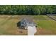 Aerial view of a two-story house with a two-car garage at 91 Walker Grove Ln, Lillington, NC 27546