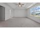 Spacious bedroom with ceiling fan and large windows at 91 Walker Grove Ln, Lillington, NC 27546