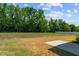 Backyard with patio and view of trees and a pool at 91 Walker Grove Ln, Lillington, NC 27546