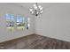 Bright dining room with hardwood floors and a chandelier at 91 Walker Grove Ln, Lillington, NC 27546