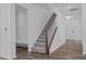 Staircase with wooden railing and built-in bench at 91 Walker Grove Ln, Lillington, NC 27546