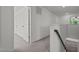 Upstairs hallway with carpet and access to bedrooms at 91 Walker Grove Ln, Lillington, NC 27546
