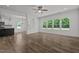 Bright living room with hardwood floors and large windows at 91 Walker Grove Ln, Lillington, NC 27546