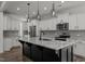 Modern kitchen with large island, stainless steel appliances, and granite countertops at 91 Walker Grove Ln, Lillington, NC 27546