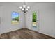Dining area with hardwood floors, chandelier, and backyard access at 91 Walker Grove Ln, Lillington, NC 27546
