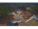 Aerial view of a new home under construction in a wooded neighborhood at 7440 Summer Tanager Trl, Raleigh, NC 27614