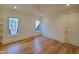 Bright bedroom with hardwood floors and large windows at 7645 Falls Creek Ln, Raleigh, NC 27614