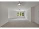 Bright bedroom with large windows and ceiling fan at 490 Birch Hollow Rd, Chapel Hill, NC 27516