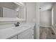 Bathroom with white vanity, quartz countertop, and matte black fixtures at 531 Booth St, Roxboro, NC 27573