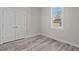 Well-lit bedroom featuring grey flooring and a closet at 531 Booth St, Roxboro, NC 27573
