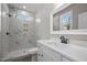 Modern bathroom with white shaker vanity, marble shower, and large mirror at 531 Booth St, Roxboro, NC 27573