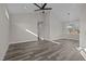 Open concept dining room with gray vinyl flooring and chandelier at 531 Booth St, Roxboro, NC 27573