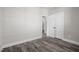 Spacious bedroom with grey floors and double doors leading to a bathroom at 531 Booth St, Roxboro, NC 27573