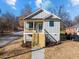 Gray sided craftsman style home with wooden stairs and front porch at 531 Booth St, Roxboro, NC 27573