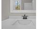 Bathroom vanity with quartz countertop and matte black faucet at 531 Booth St, Roxboro, NC 27573