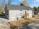 Gray sided craftsman style home with wooden stairs and side porch at 531 Booth St, Roxboro, NC 27573