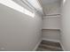 Well-lit closet with double rods and shelves for ample storage at 531 Booth St, Roxboro, NC 27573