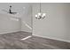 Bright dining area with hardwood floors and a chandelier at 531 Booth St, Roxboro, NC 27573