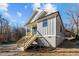 Gray sided craftsman style home with wooden stairs and side yard at 531 Booth St, Roxboro, NC 27573
