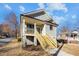 Newly constructed home with gray siding and wood stairs at 531 Booth St, Roxboro, NC 27573