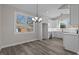 Modern white kitchen with stainless steel appliances at 531 Booth St, Roxboro, NC 27573