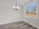 Dining area with hardwood floors and large window at 531 Booth St, Roxboro, NC 27573