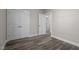 Spacious bedroom with grey flooring and double doors at 531 Booth St, Roxboro, NC 27573