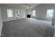 Large living area showcasing a fireplace and access to other rooms at 32 Scotties Ridge Dr, Princeton, NC 27569