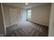 Bright bedroom with two closets and neutral carpeting at 32 Scotties Ridge Dr, Princeton, NC 27569