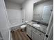 Clean bathroom with granite vanity and bathtub at 32 Scotties Ridge Dr, Princeton, NC 27569