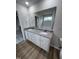 Bathroom boasts double sinks, granite vanity, and large mirror at 32 Scotties Ridge Dr, Princeton, NC 27569