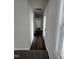 Long hallway with dark wood floors at 72 Scotties Ridge Dr, Princeton, NC 27569