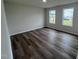 Bright bedroom with two windows and wood-look flooring at 72 Scotties Ridge Dr, Princeton, NC 27569