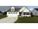 Newly built two-story home with white siding and a two-car garage at 72 Scotties Ridge Dr, Princeton, NC 27569