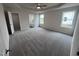 Main bedroom with carpet, ceiling fan, and en-suite bathroom at 72 Scotties Ridge Dr, Princeton, NC 27569