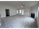 Spacious living room with fireplace and ceiling fan at 72 Scotties Ridge Dr, Princeton, NC 27569