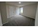 Bright bedroom with grey carpet and double closets at 72 Scotties Ridge Dr, Princeton, NC 27569