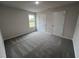 Spacious bedroom with grey carpet and double closets at 72 Scotties Ridge Dr, Princeton, NC 27569