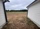 View of the backyard from between house and garage at 72 Scotties Ridge Dr, Princeton, NC 27569