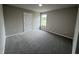 Spacious bedroom with carpet flooring and a window at 158 Scotties Ridge Dr, Princeton, NC 27569