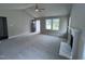 Spacious living room with gray carpet, fireplace, and high ceilings at 158 Scotties Ridge Dr, Princeton, NC 27569