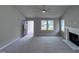 Bright living room with a fireplace and access to the front door at 158 Scotties Ridge Dr, Princeton, NC 27569