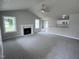 Open concept living room with kitchen and fireplace views at 158 Scotties Ridge Dr, Princeton, NC 27569