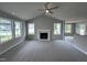 Open living room with a fireplace and view into kitchen at 158 Scotties Ridge Dr, Princeton, NC 27569