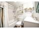 Clean bathroom with a tub shower, toilet and vanity at 101 Mulberry Ln, Dunn, NC 28334