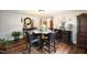 Dining room with a glass-top table and four black chairs at 101 Mulberry Ln, Dunn, NC 28334