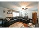 Living room with sectional sofa, hardwood floors, and a ceiling fan at 101 Mulberry Ln, Dunn, NC 28334