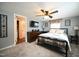 Bright bedroom features ceiling fan, carpet, and large windows at 101 Mulberry Ln, Dunn, NC 28334