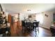 Dining area with glass-top table, four chairs, and kitchen views at 101 Mulberry Ln, Dunn, NC 28334